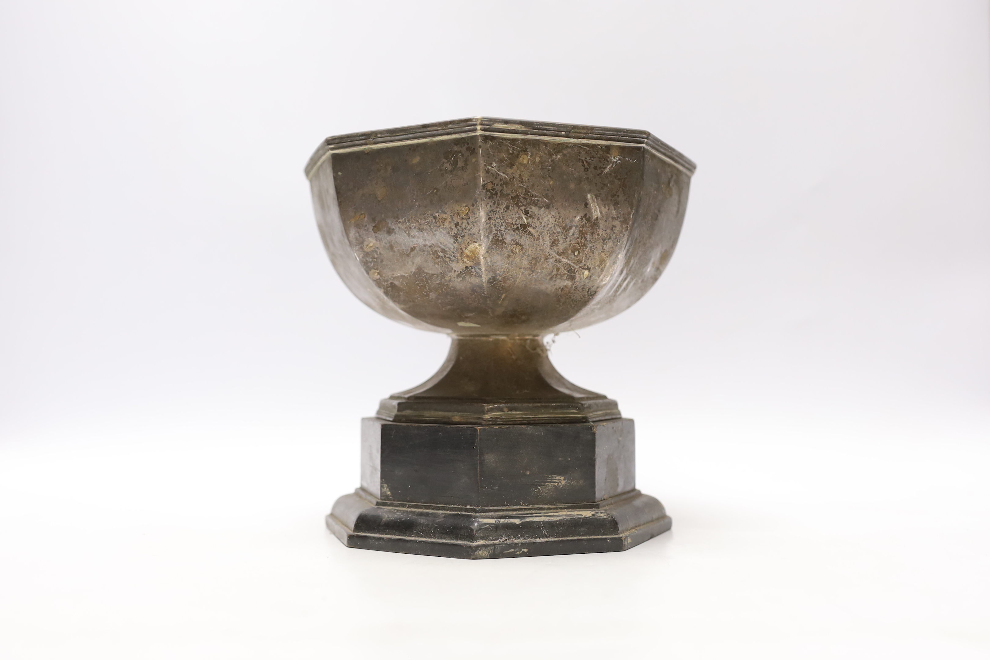 A George V silver octagonal presentation trophy bowl, John Henry Potter, Sheffield, 1930, diameter 18.2cm, 17oz, on an ebonised plinth base.